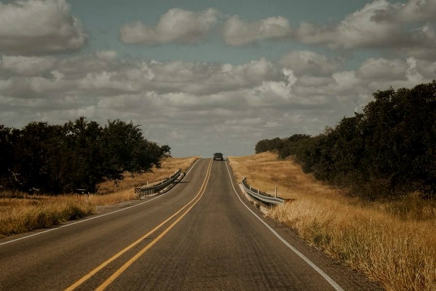 Empty country road under an open sky, representative image