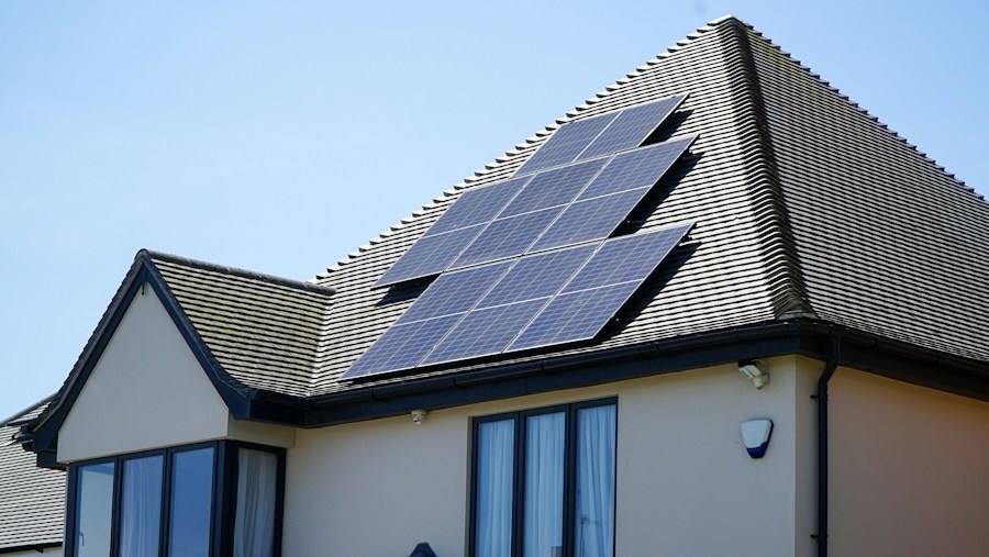 House with solar panels on the roof, representative image
